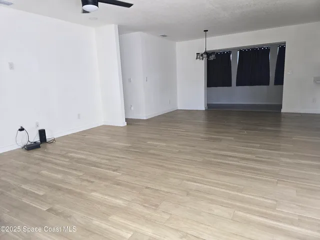 a view of a big room with wooden floor