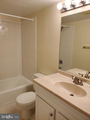 1501 Audmar Drive McLean, VA 22101 - Photo 11 of 24 a bathroom with a sink toilet and shower