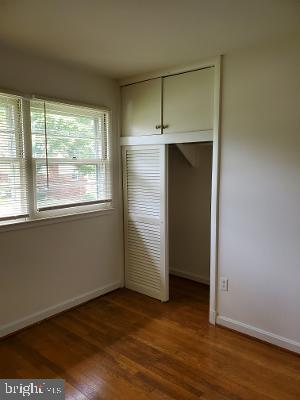 1501 Audmar Drive McLean, VA 22101 - Photo 19 of 24 an empty room with wooden floor closet and windows