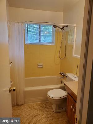 1501 Audmar Drive McLean, VA 22101 - Photo 10 of 24 a bathroom with a toilet and a shower