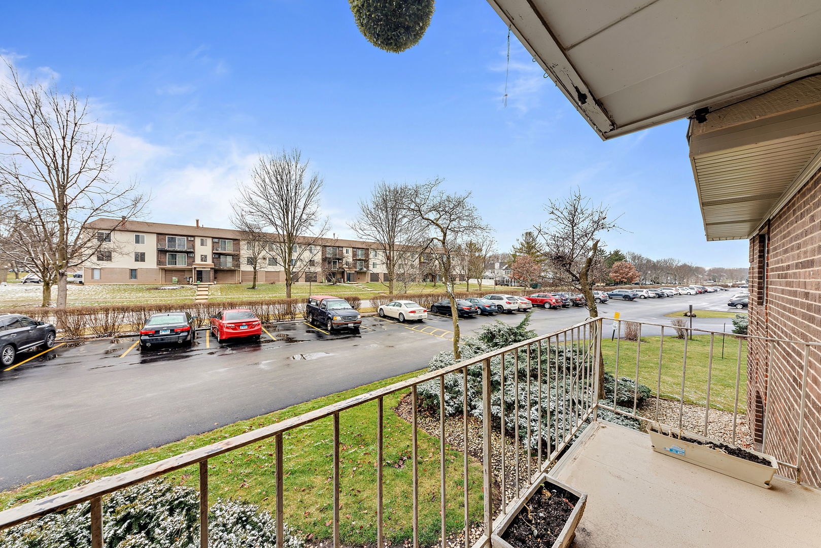 218 East Bailey Road, Unit E Naperville, IL 60565 - Photo 15 of 23 a city view with tall buildings and cars parked in front of it