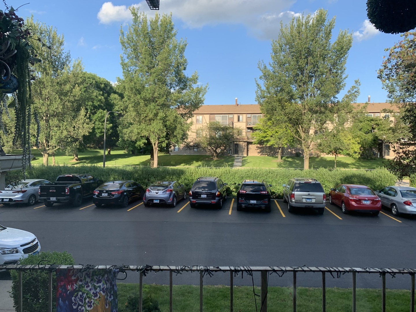 218 East Bailey Road, Unit E Naperville, IL 60565 - Photo 16 of 23 a view of a street with cars park