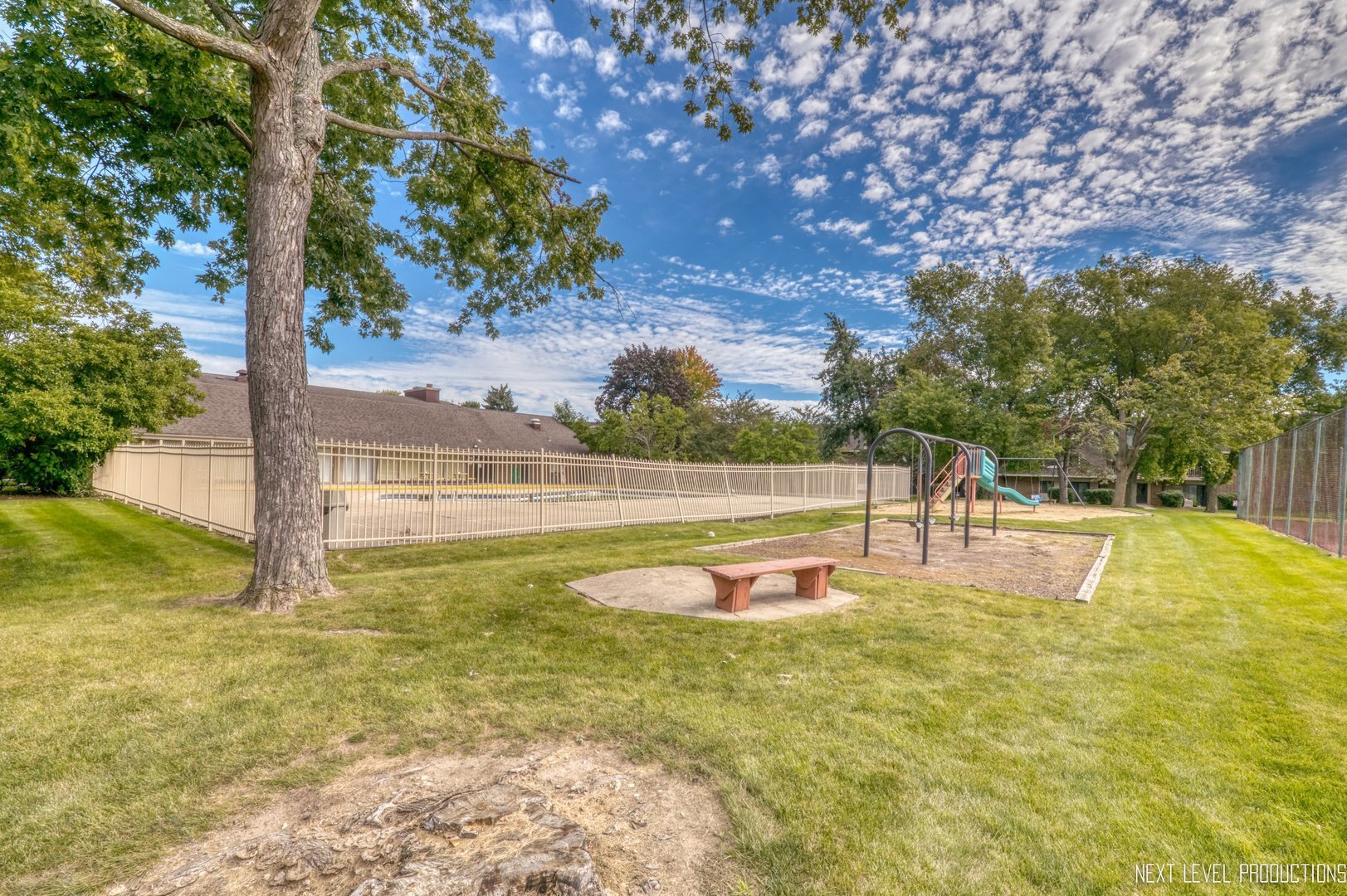 218 East Bailey Road, Unit E Naperville, IL 60565 - Photo 19 of 23 a view of a swimming pool with an outdoor seating and a yard