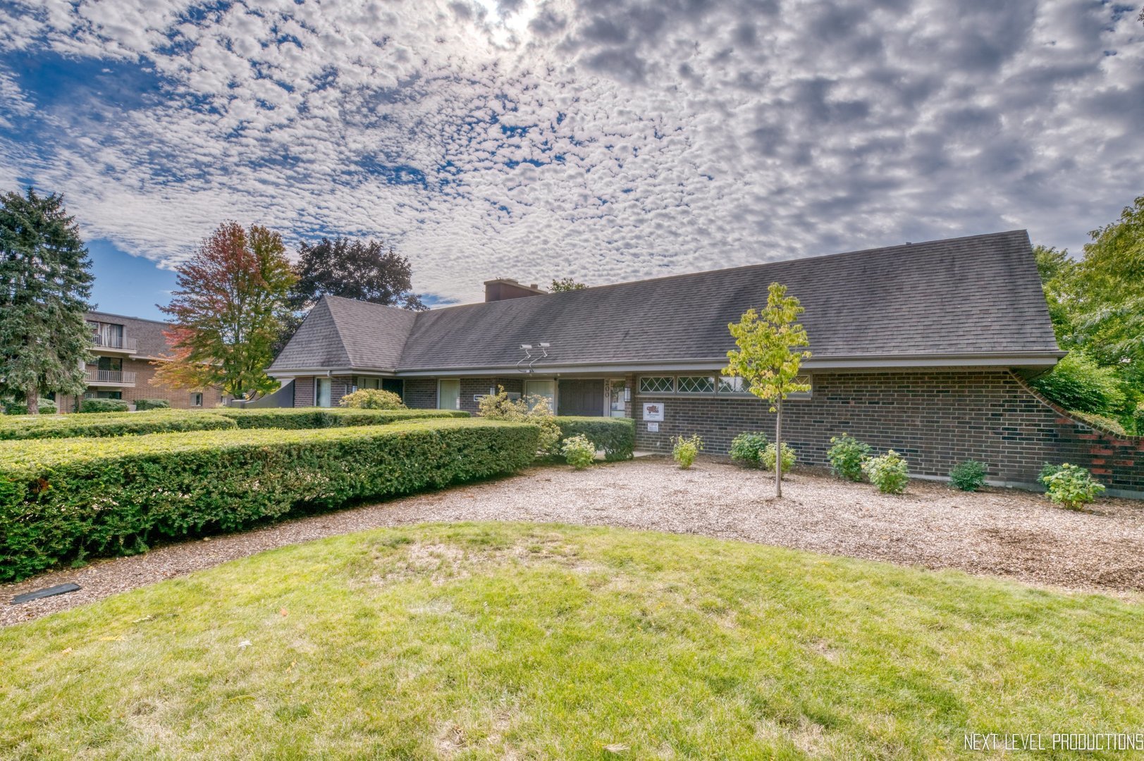 218 East Bailey Road, Unit E Naperville, IL 60565 - Photo 20 of 23 a front view of a house with garden