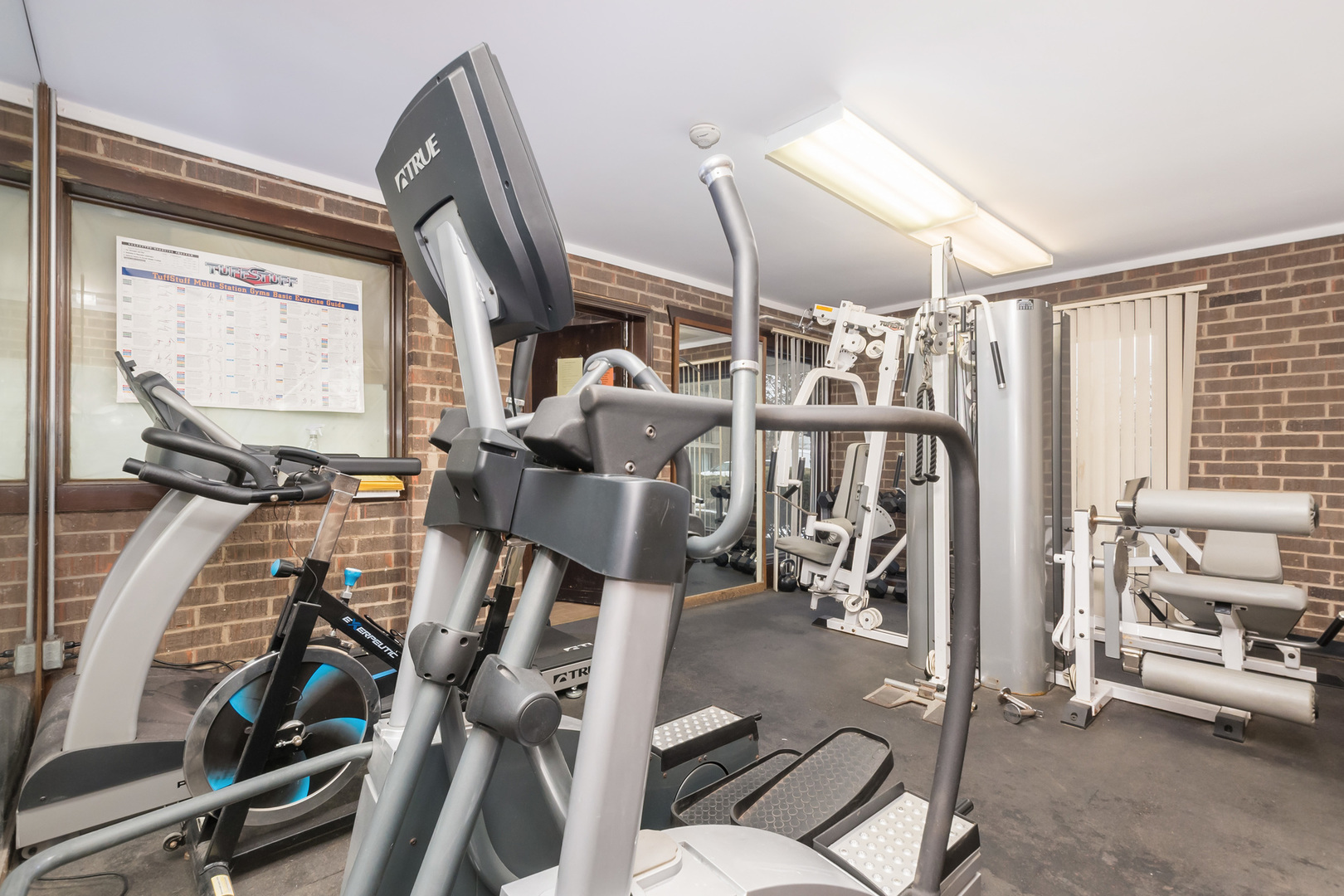 218 East Bailey Road, Unit E Naperville, IL 60565 - Photo 21 of 23 a view of a room with gym equipment