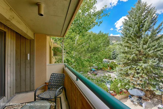 a view of balcony with wooden floor