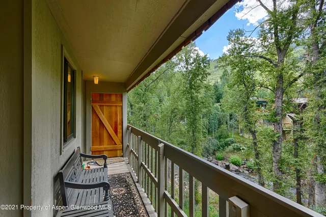 a view of balcony with furniture