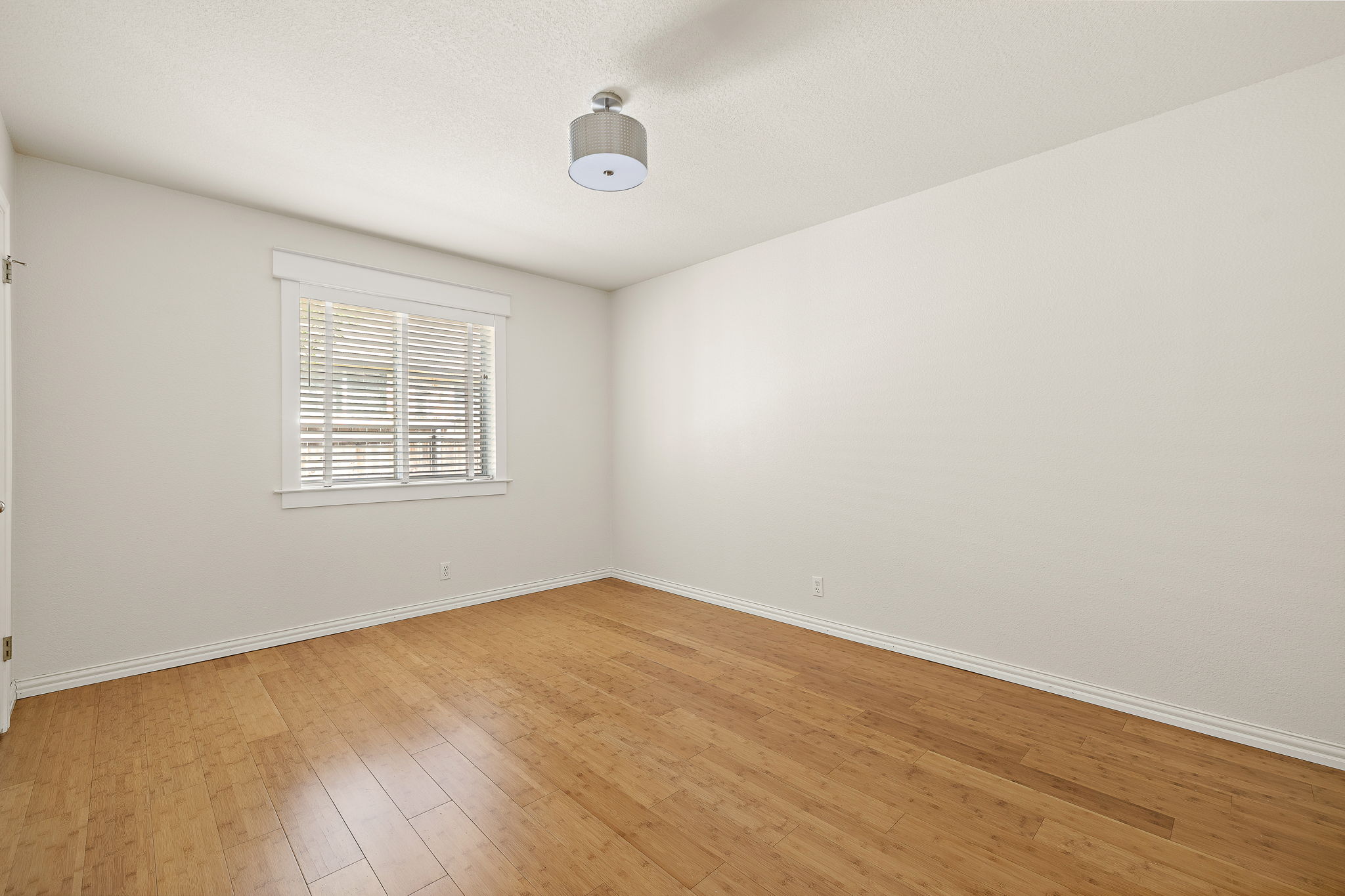 1102 Nelson Ranch Road Cedar Park, TX 78613 - Photo 29 of 37 Hardwood floors and bright window light complete this inviting, unfurnished bedroom.