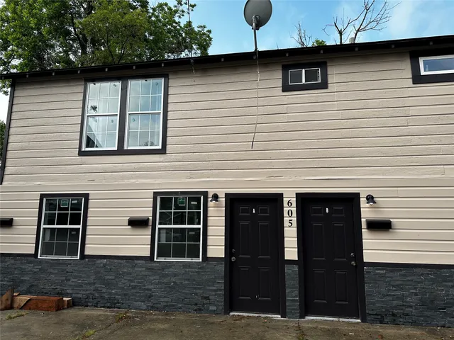a front view of a house with garage