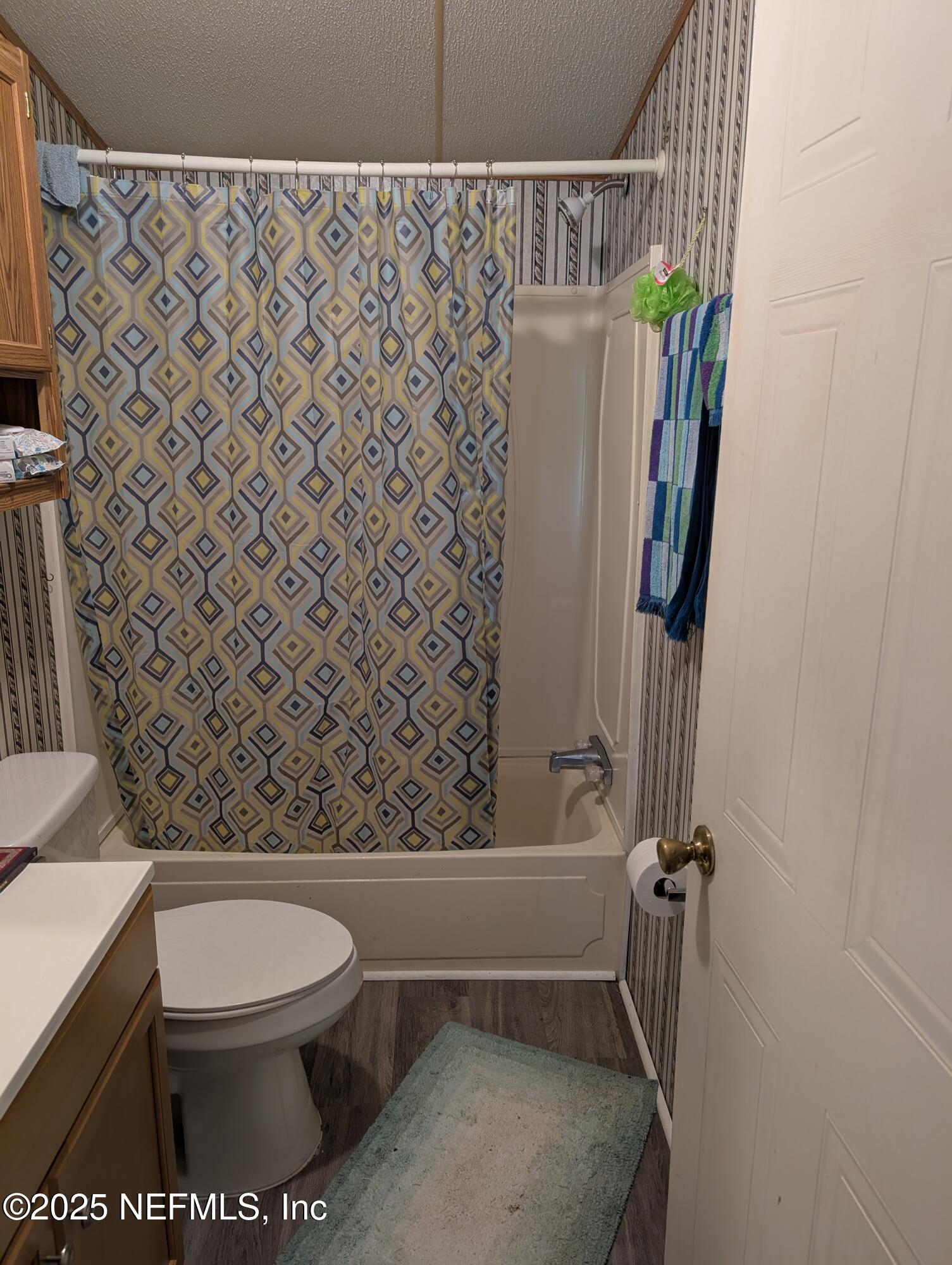 402 Shirley Street Interlachen, FL 32148 - Photo 15 of 20 a bathroom with a toilet and a shower