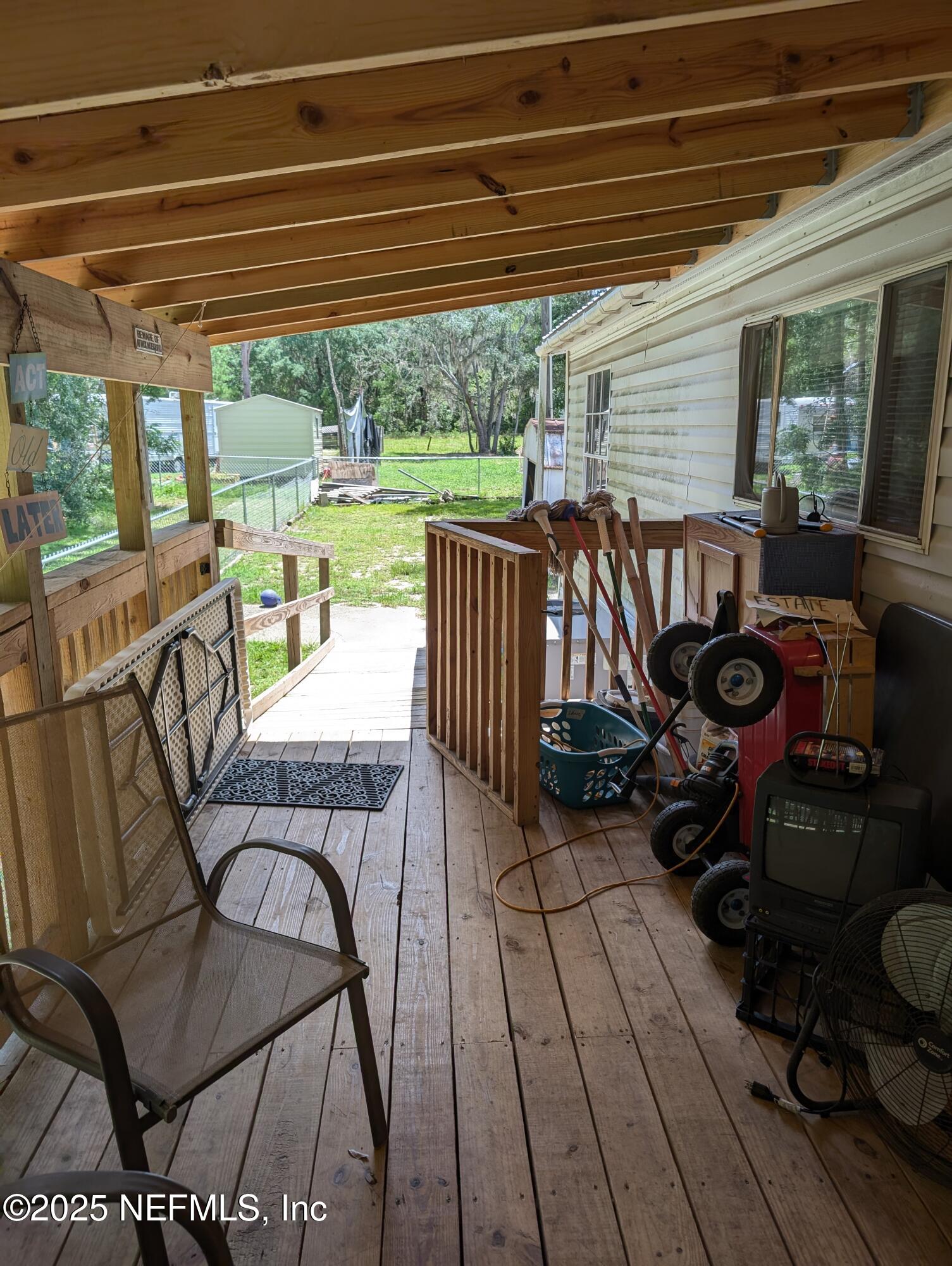 402 Shirley Street Interlachen, FL 32148 - Photo 19 of 20 a view of a chairs and table in the patio