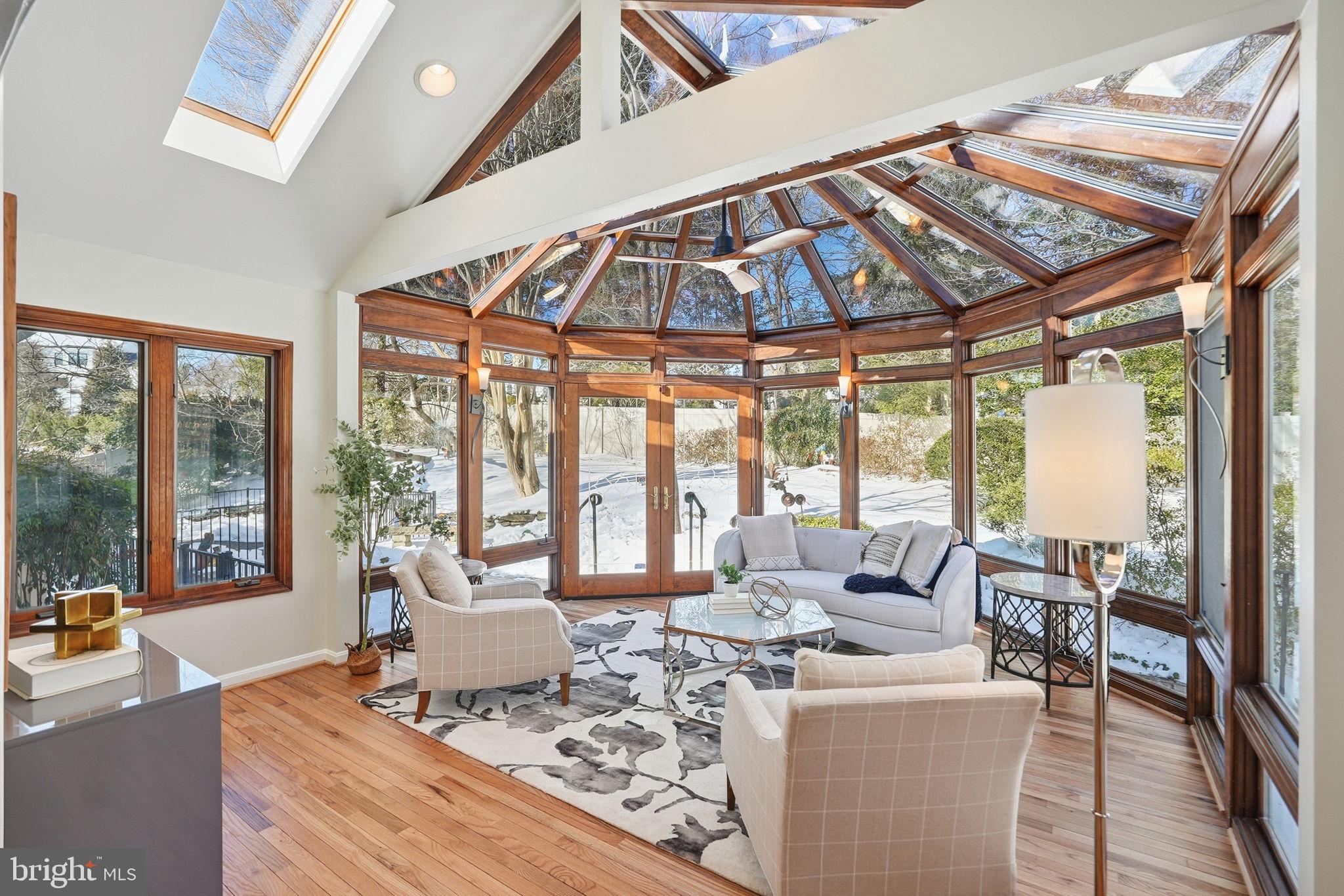 7511 Shadywood Road Bethesda, MD 20817 - Photo 11 of 29 Sun Porch open to lush backyard retreat