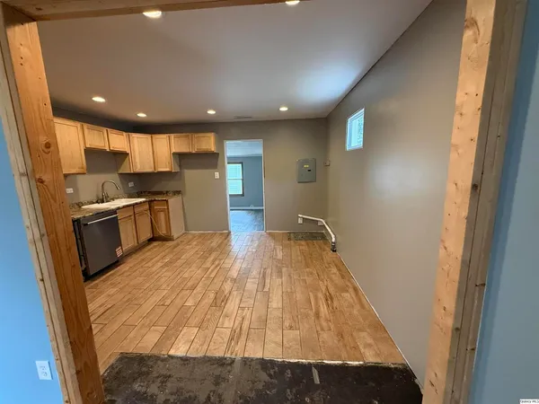 a view of kitchen with wooden floor