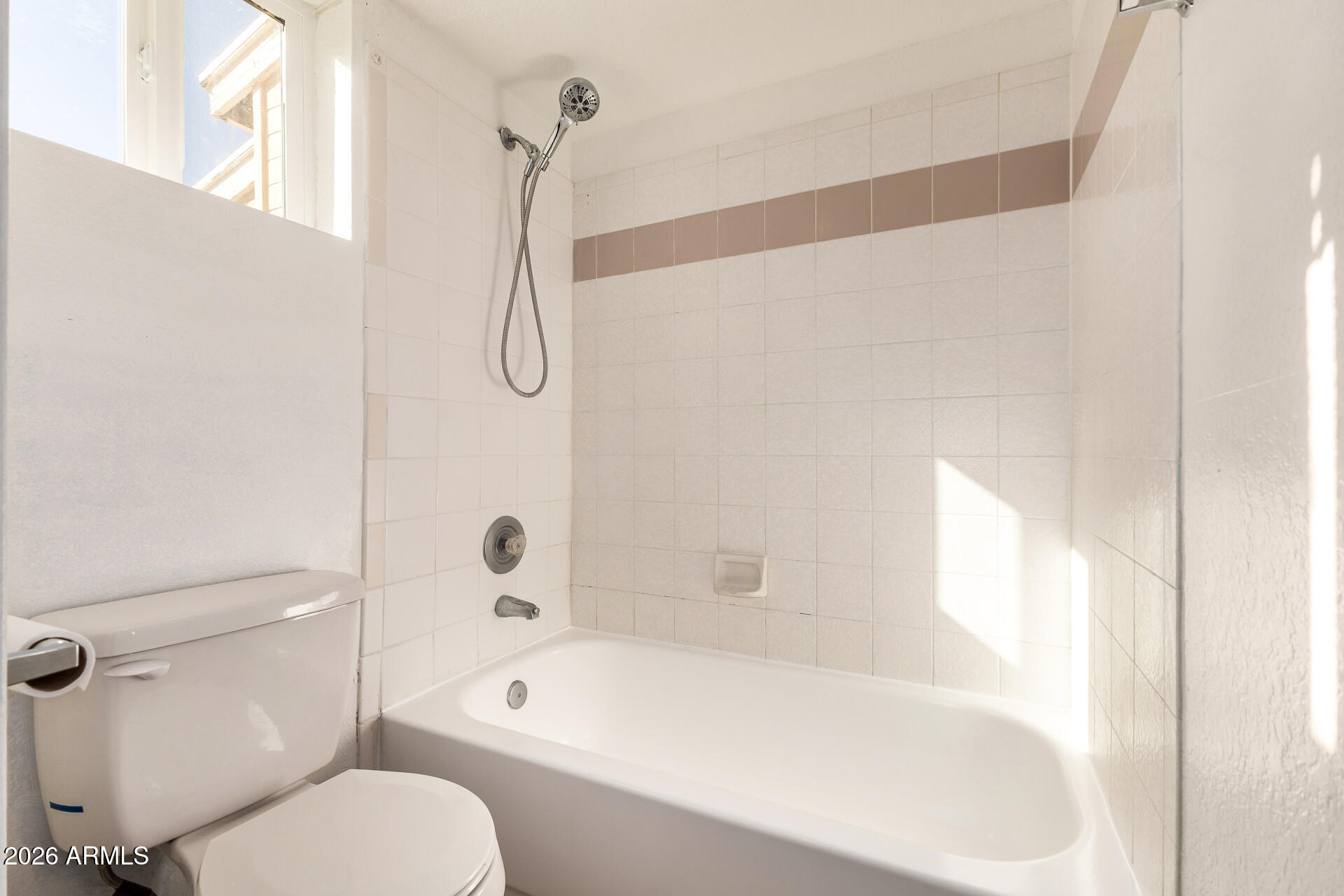 510 North Alma School Road, Unit 159 Mesa, AZ 85201 - Photo 13 of 31 a bathroom with a granite countertop bathtub shower and toilet