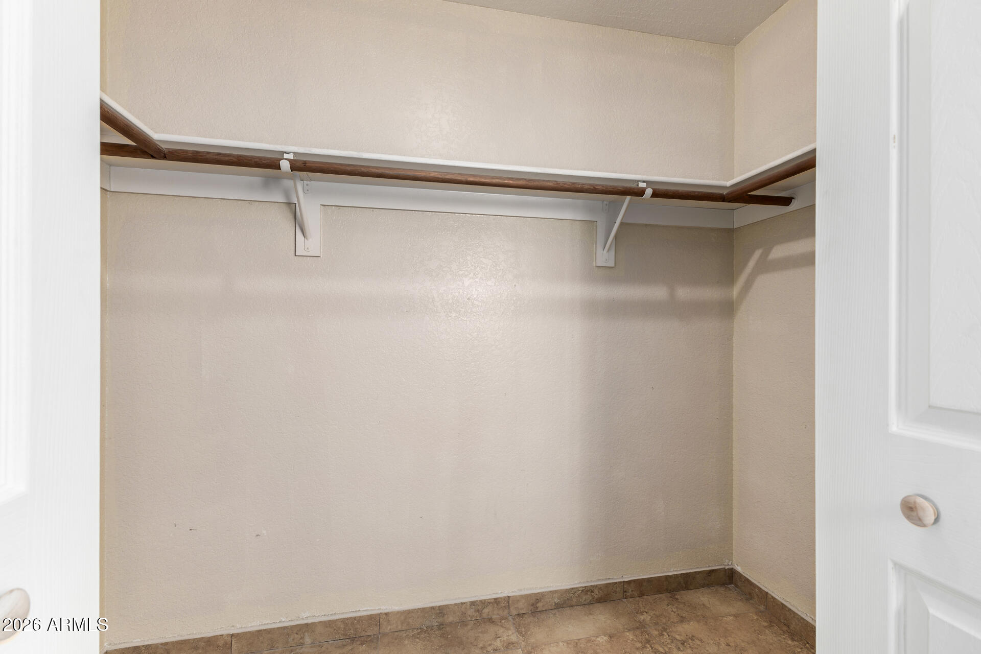 510 North Alma School Road, Unit 159 Mesa, AZ 85201 - Photo 14 of 31 a view of a room with racks on the wall