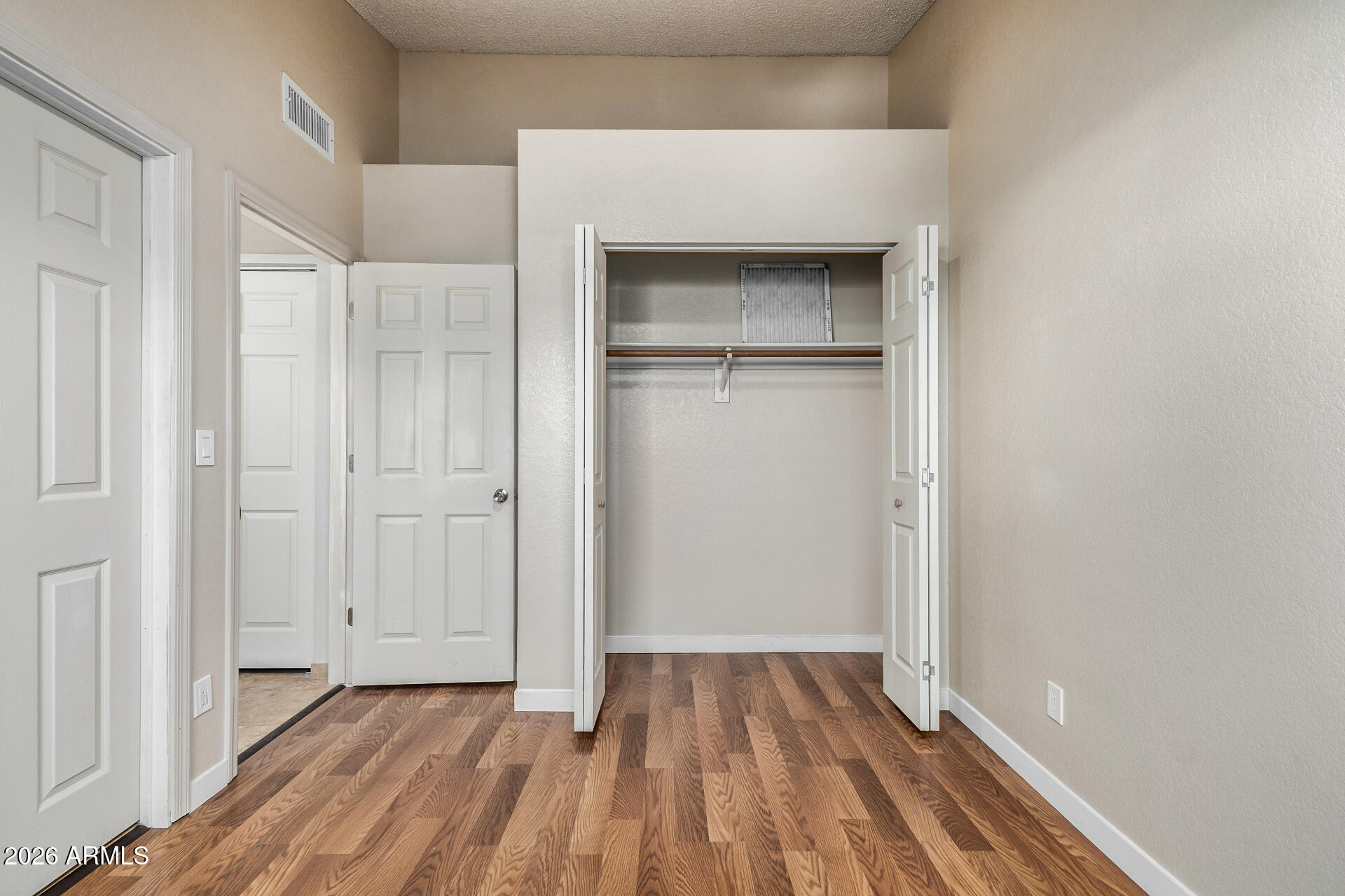 510 North Alma School Road, Unit 159 Mesa, AZ 85201 - Photo 16 of 31 a view of an empty room with cabinet and a window