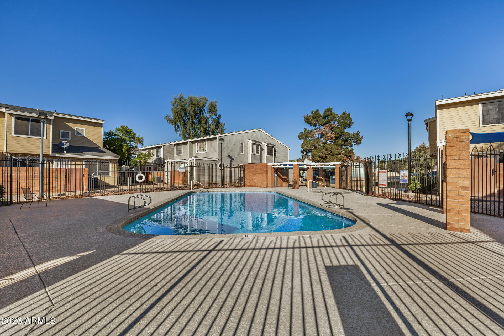 510 North Alma School Road, Unit 159 Mesa, AZ 85201 - Photo 22 of 31 a front view of a house with swimming pool