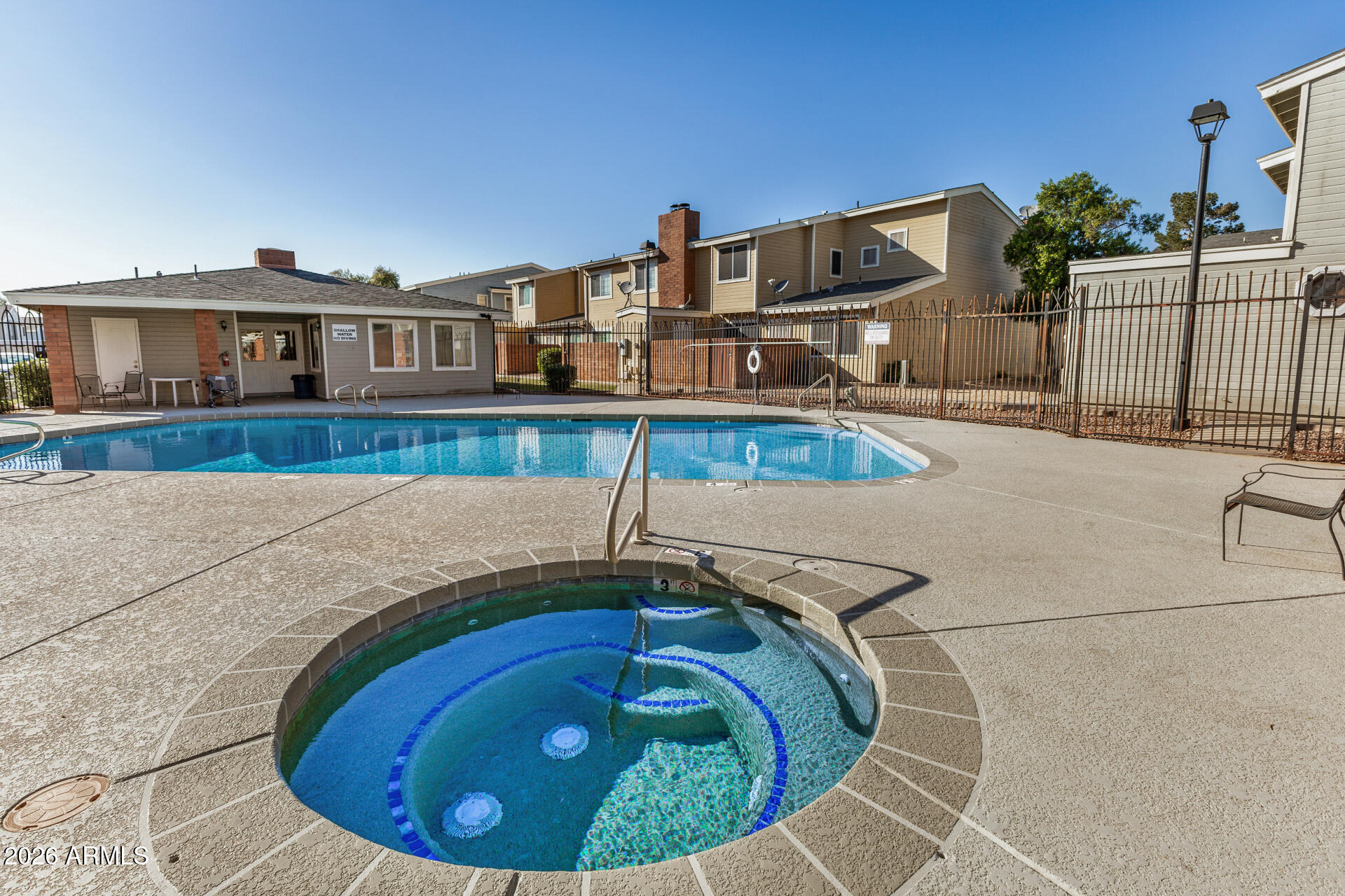 510 North Alma School Road, Unit 159 Mesa, AZ 85201 - Photo 23 of 31 a view of houses with a swimming pool
