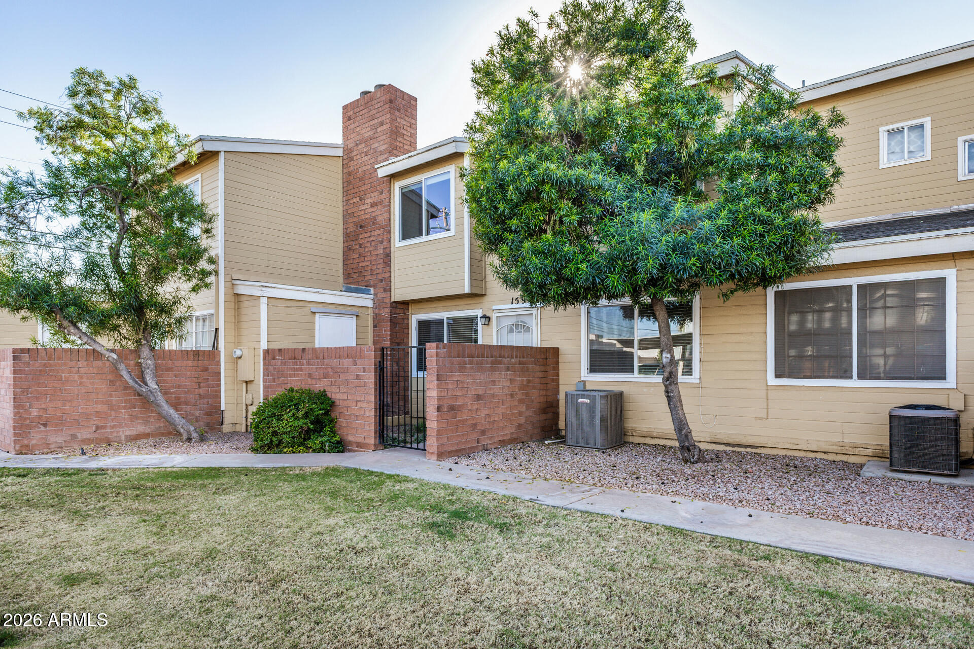510 North Alma School Road, Unit 159 Mesa, AZ 85201 - Photo 26 of 31 a front view of a house with garden
