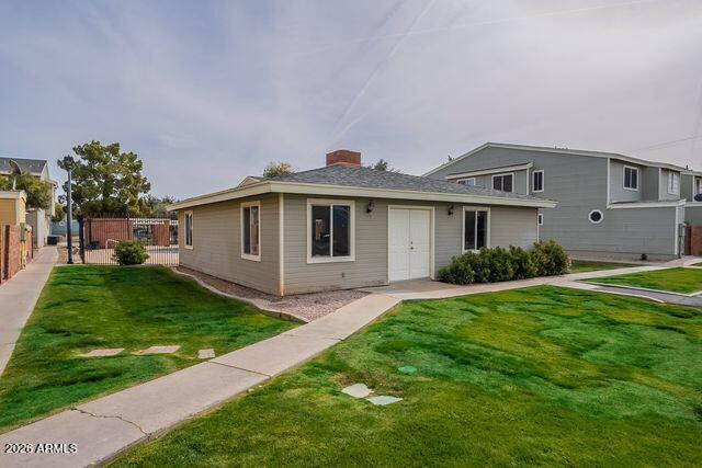 510 North Alma School Road, Unit 159 Mesa, AZ 85201 - Photo 29 of 31 a front view of a house with a garden