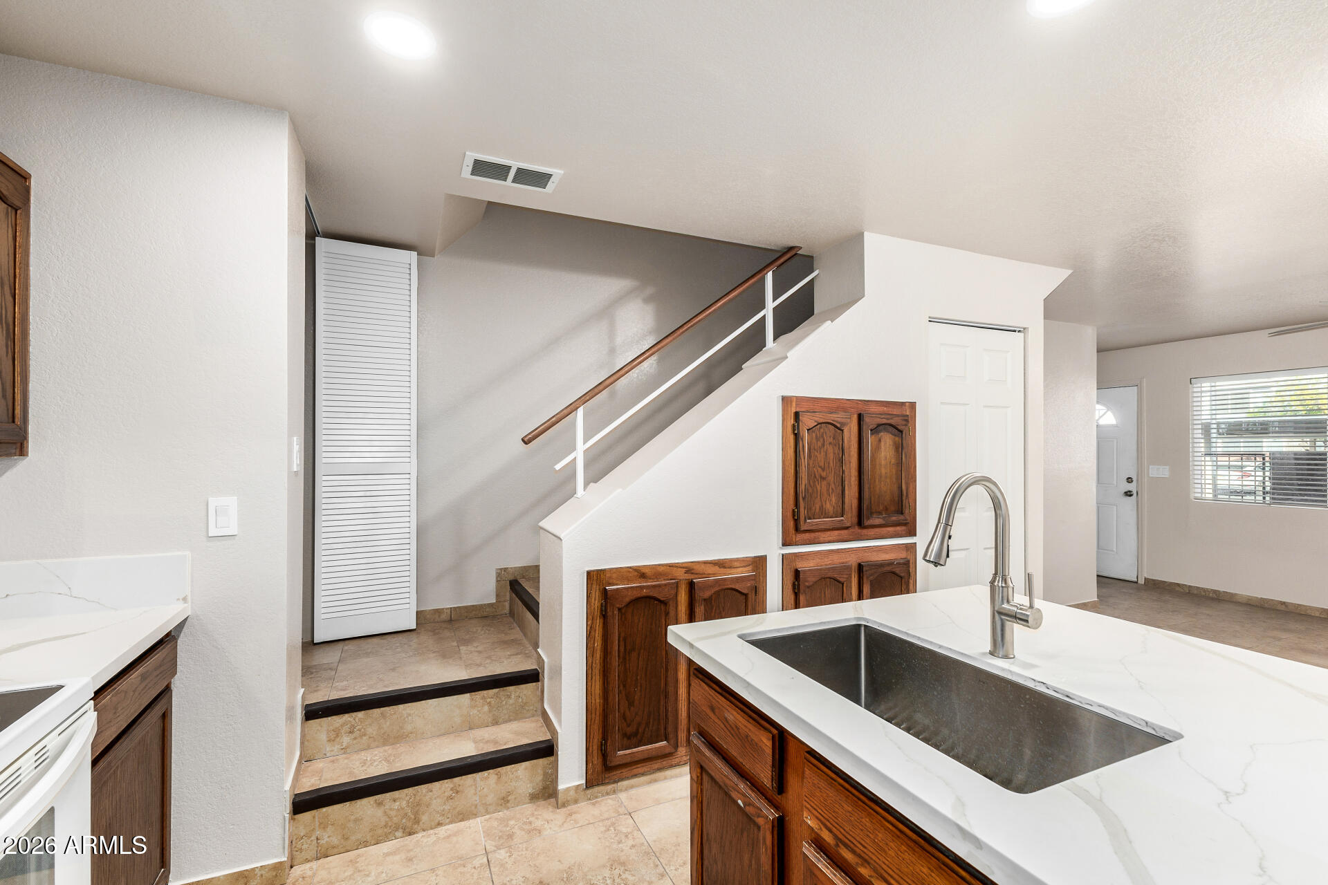 510 North Alma School Road, Unit 159 Mesa, AZ 85201 - Photo 9 of 31 a kitchen with a sink and a refrigerator
