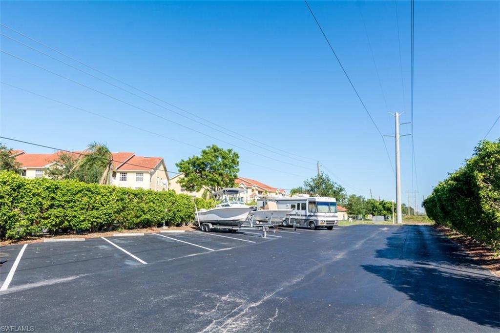 4635 St Croix Lane, Unit 1218 Naples, FL 34109 - Photo 40 of 40 View of uncovered parking lot