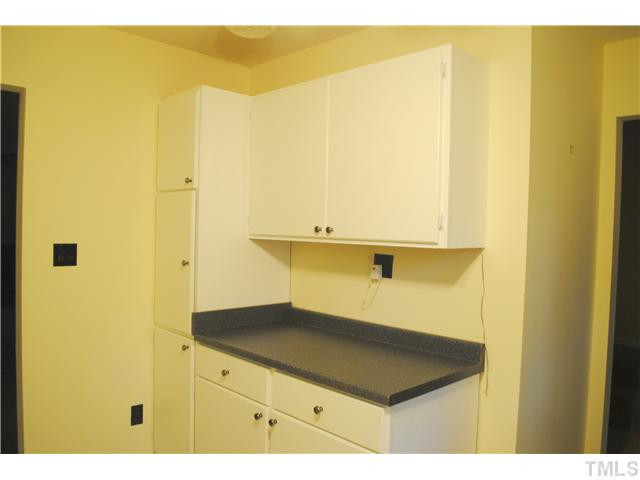 5745 3 Oaks Drive Raleigh, NC 27612 - Photo 5 of 12 a kitchen with a sink