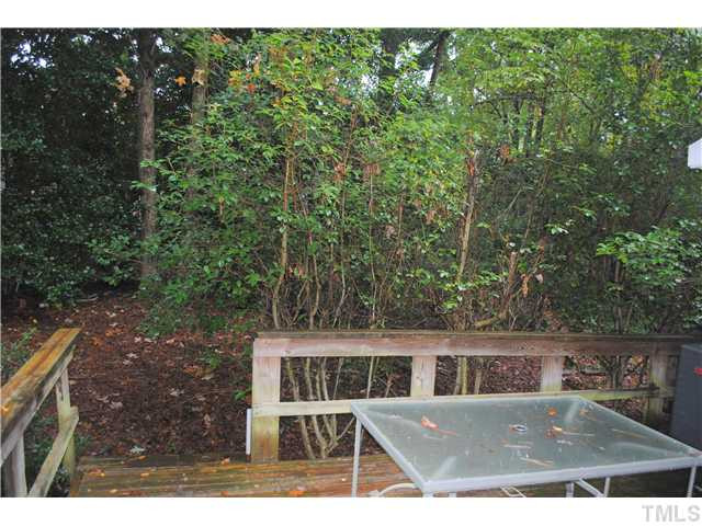 5745 3 Oaks Drive Raleigh, NC 27612 - Photo 7 of 12 a view of a house with a backyard