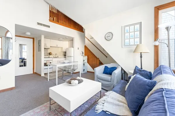 a living room with furniture and a table