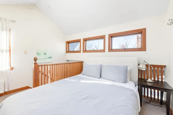 a bedroom with a bed and a table