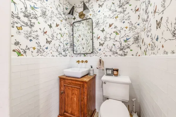 a bathroom with a toilet and a sink