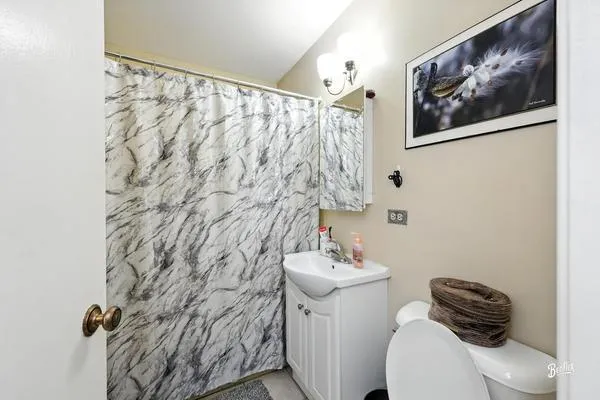 a bathroom with a toilet and sink