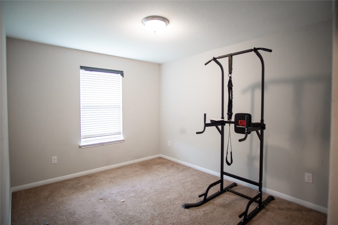 124 Guemal Road Buda, TX 78610 - Photo 12 of 14 a view of a room with gym equipment