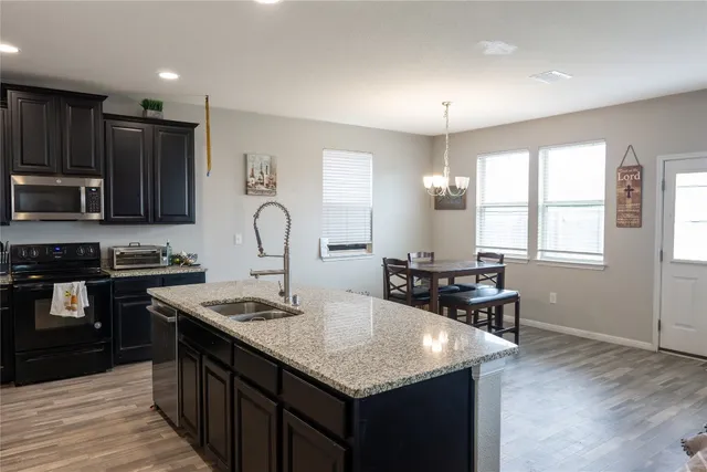 a kitchen with counter space cabinets and appliances