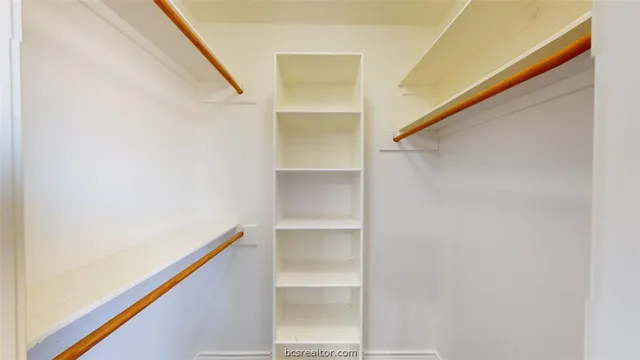 a view of an empty walk in closet