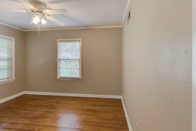 a view of an entryway with a chandelier fan