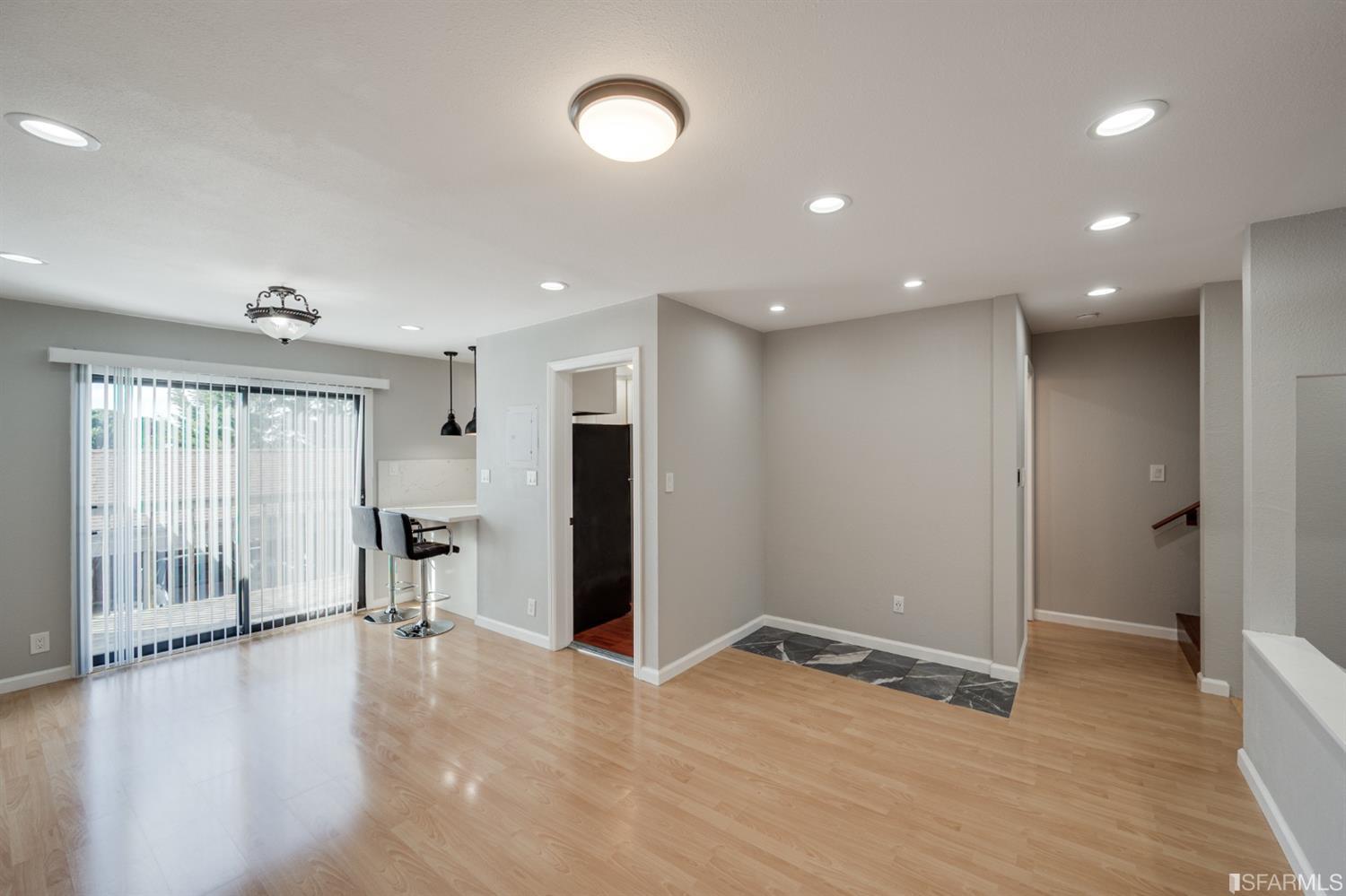 511 King Drive, Unit 5 Daly City, CA 94015 - Photo 14 of 51 an empty room with wooden floor and a ceiling fan