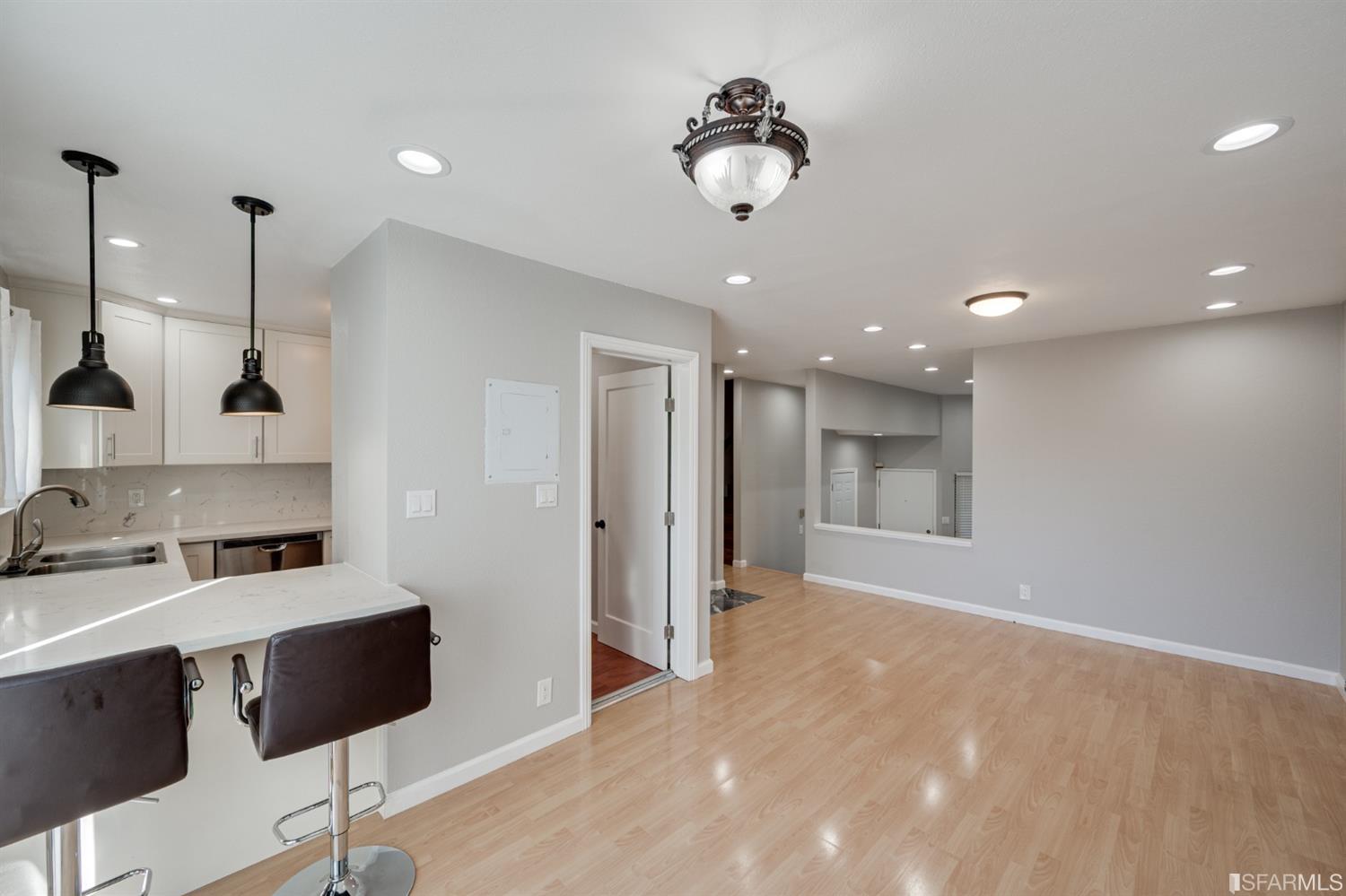511 King Drive, Unit 5 Daly City, CA 94015 - Photo 15 of 51 a view of kitchen with kitchen island stainless steel appliances a sink cabinets and a counter top space