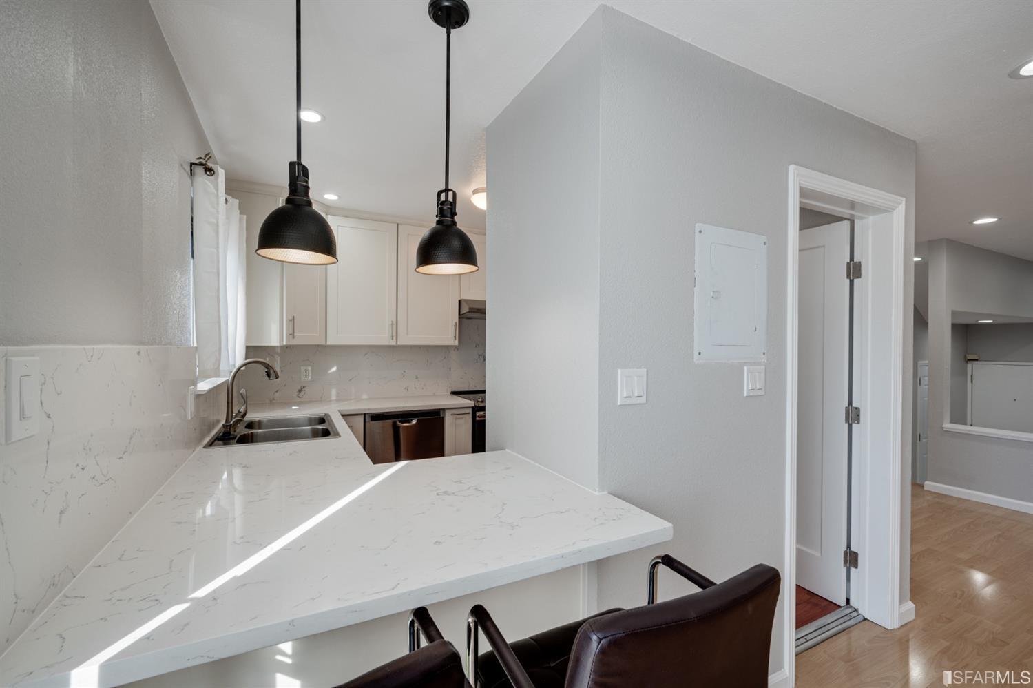 511 King Drive, Unit 5 Daly City, CA 94015 - Photo 18 of 51 a kitchen with stainless steel appliances a sink a stove and a refrigerator