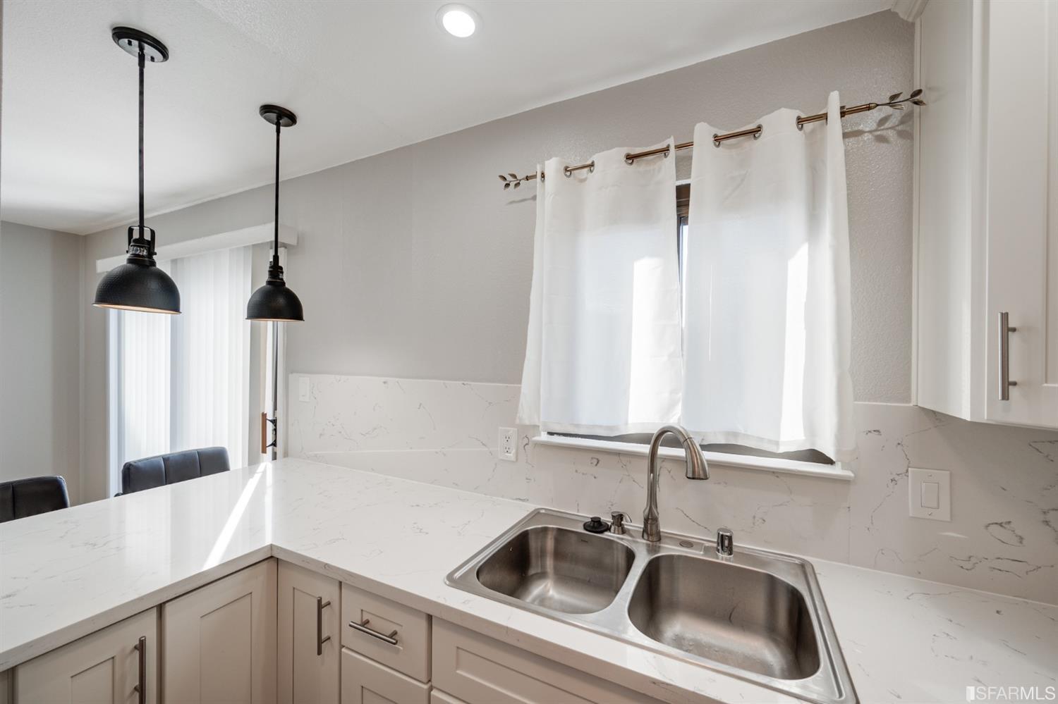 511 King Drive, Unit 5 Daly City, CA 94015 - Photo 21 of 51 a kitchen that has a sink a window and cabinets