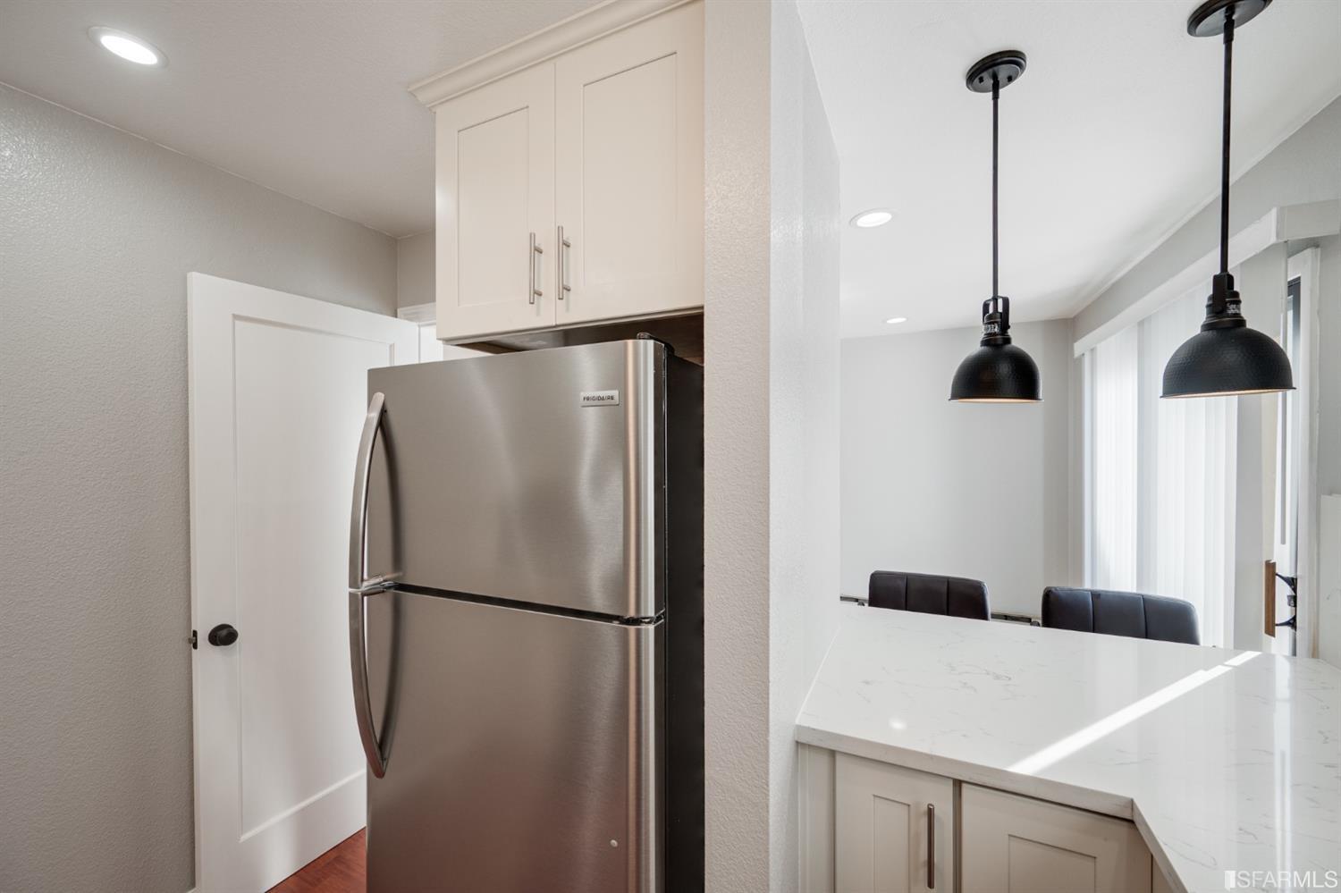 511 King Drive, Unit 5 Daly City, CA 94015 - Photo 22 of 51 a refrigerator freezer and a stove sitting inside of a kitchen
