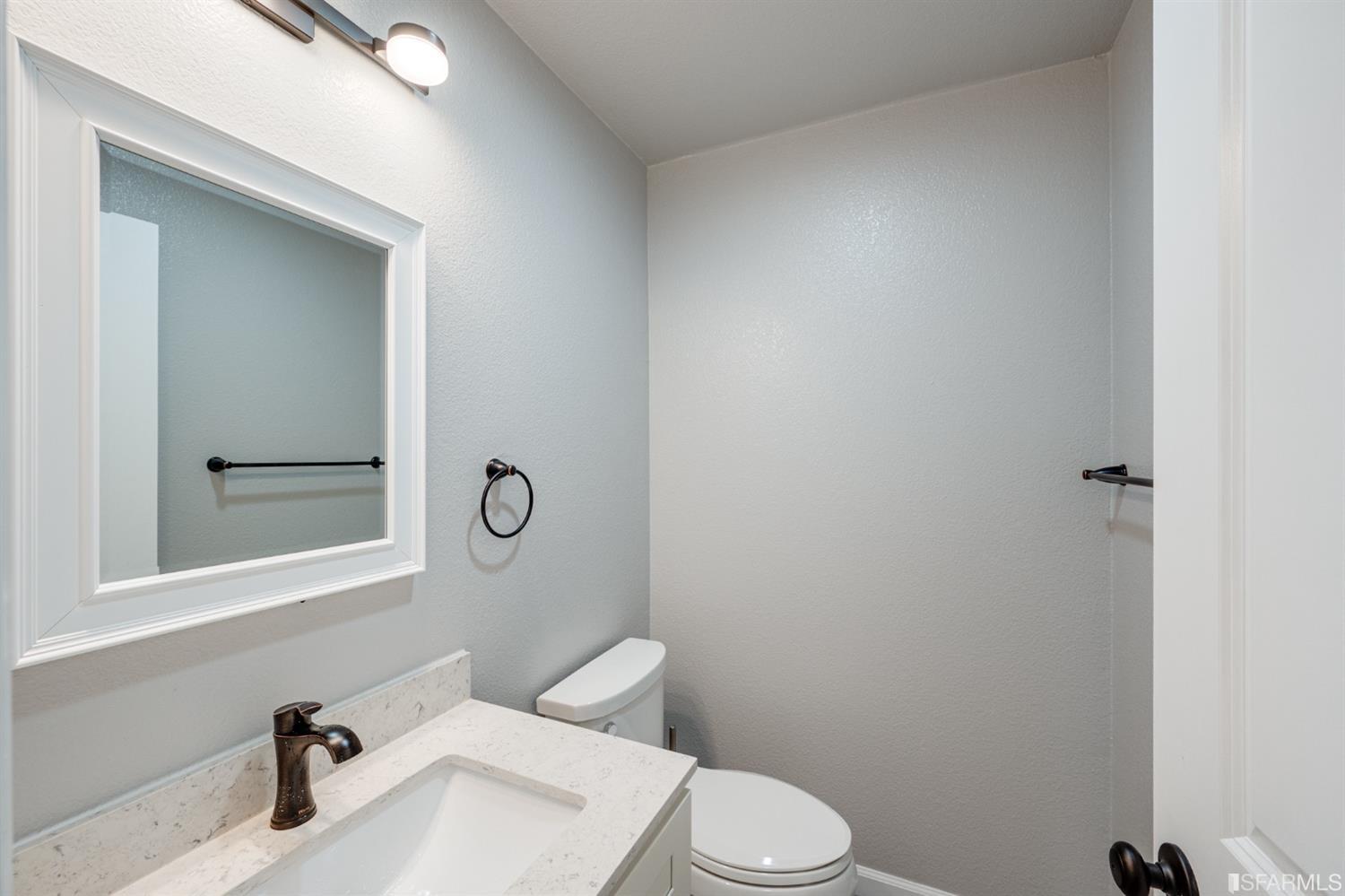511 King Drive, Unit 5 Daly City, CA 94015 - Photo 24 of 51 a bathroom with a sink toilet and mirror
