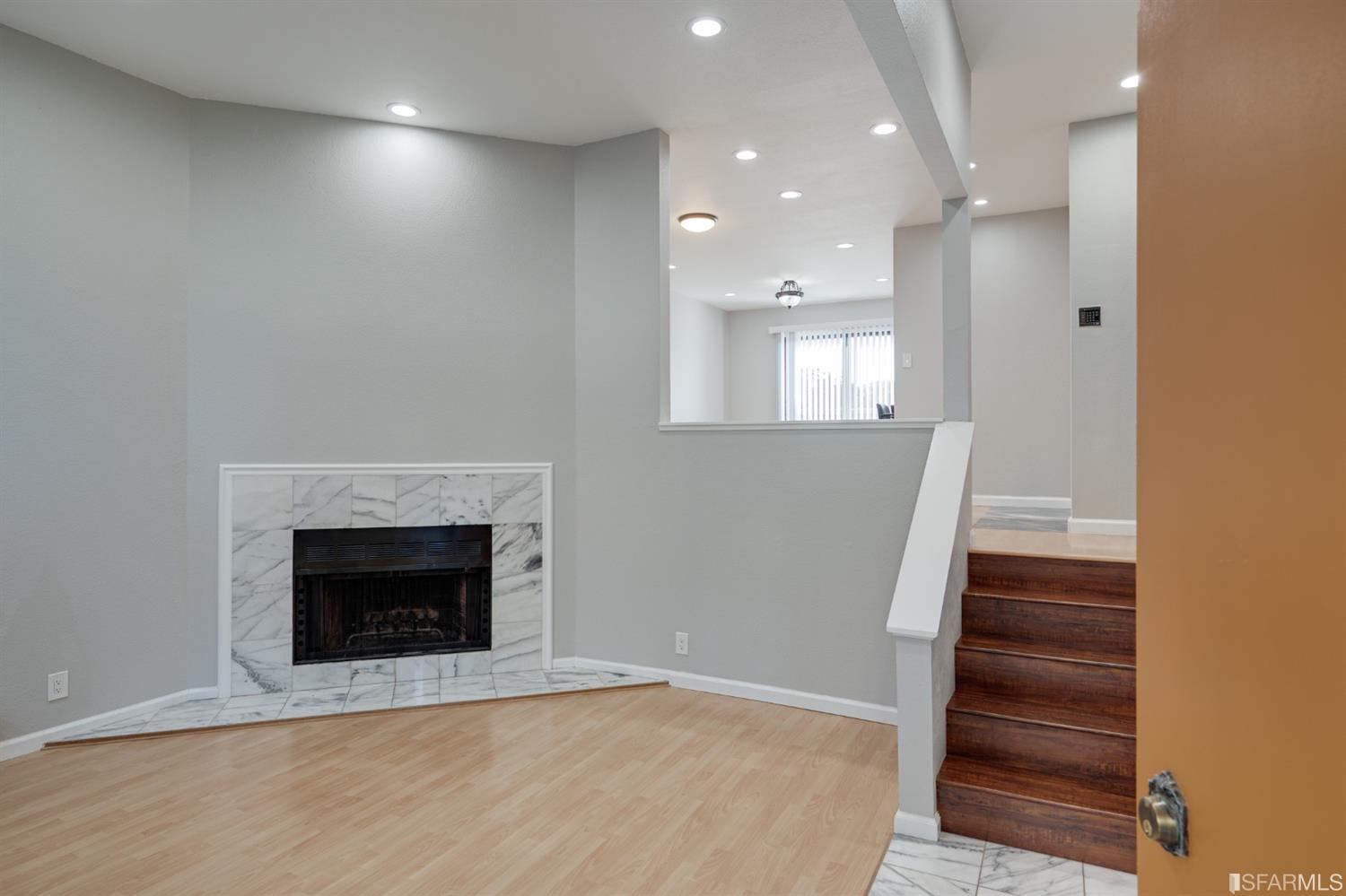 511 King Drive, Unit 5 Daly City, CA 94015 - Photo 3 of 51 an entryway and an empty room with a fireplace