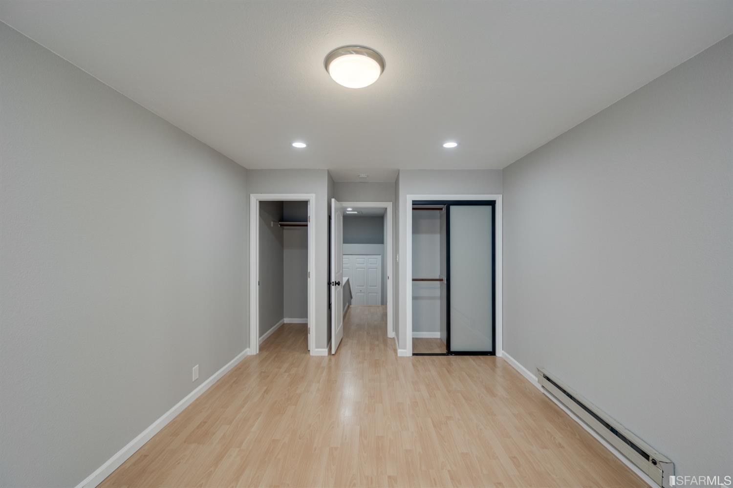 511 King Drive, Unit 5 Daly City, CA 94015 - Photo 40 of 51 an empty room with wooden floor and window
