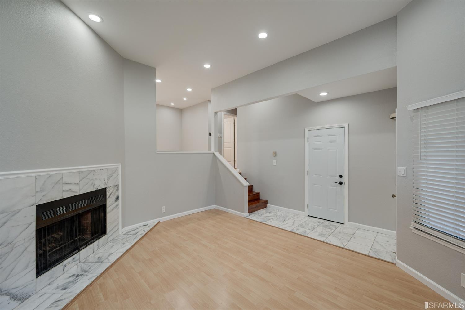 511 King Drive, Unit 5 Daly City, CA 94015 - Photo 7 of 51 a view of empty room with a fireplace and wooden floor