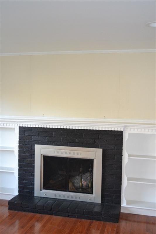 17 Wolley Road Hyannis, MA 02601 - Photo 5 of 11 a fireplace with a hallway