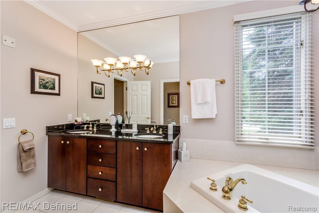 5637 Kirkridge Trail Rochester, MI 48306 - Photo 15 of 36 Beautiful 42" vanity with granite, jetted soaking tub, spacious shower, and private water closet.