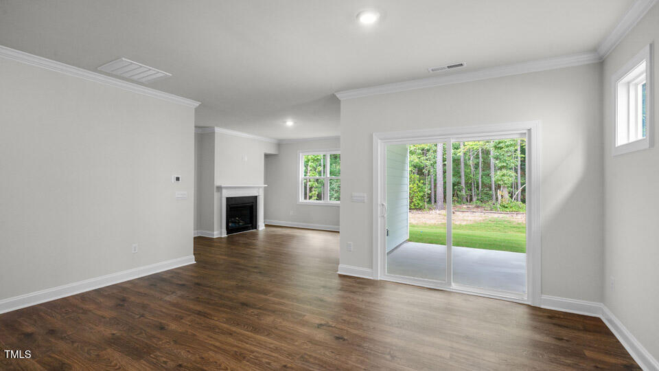 2222 Redpoll Drive Apex, NC 27539 - Photo 14 of 38 wooden floor in an empty room with a window