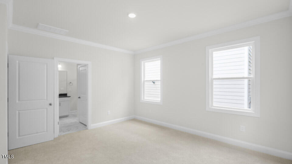 2222 Redpoll Drive Apex, NC 27539 - Photo 19 of 38 a view of an empty room with a window