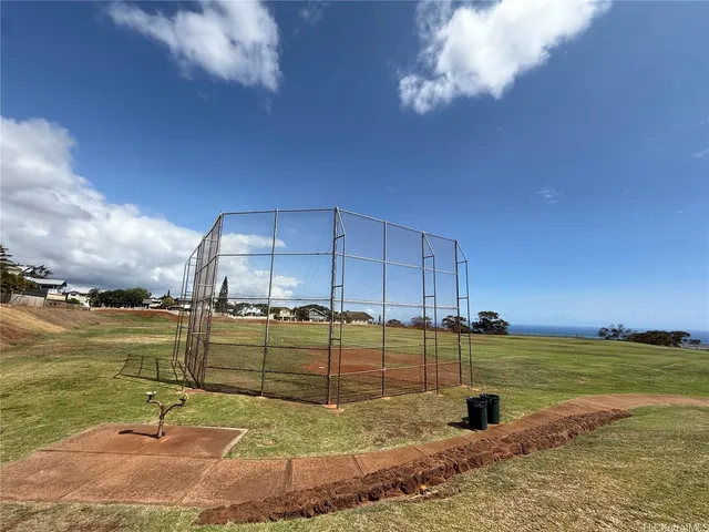 a view of outdoor space with playground and green space